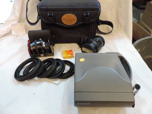 lot 177 image: Mixed lot of lenses a Polaroid camera and a camera bag