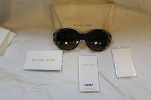 lot 216 image: Michael Kors sunglasses with case