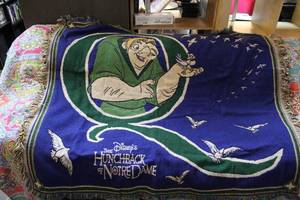 lot 245 image: Walt Disneys Hunchback of Notre Dame Tapestry Blanket featuring Quasimodo.