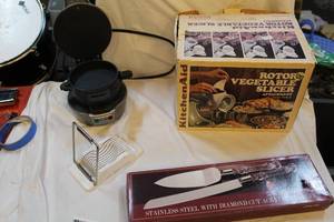 lot 344 image: KitchenAid vegetable slicer egg slicersandwich maker-piece hostess set stainless steel knife and spatula