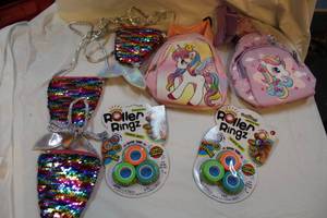 lot 369 image: Kids purses and over the shoulder backpack and roller ringz