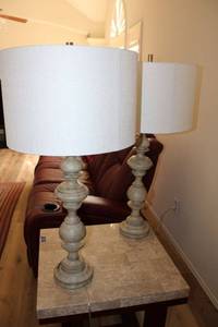 lot 9 image: Pair of table lamps. Spindle type base with washed wood look.