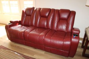 lot 10 image: Red Dual reclining sofa couch. Cup holders have light, seat controls, and USB port