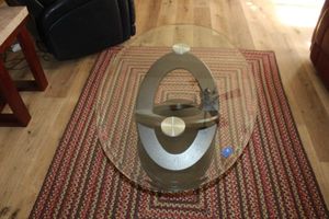 lot 11 image: Modern Oval glass top coffee table