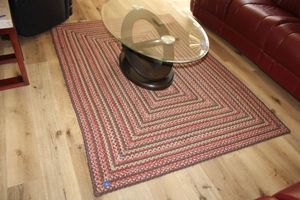 lot 12 image: Rectangular woven area rug