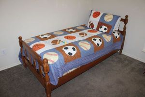 lot 19 image: Twin size wood bed frame (mattress available)