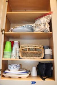 lot 36 image: Plastic and styrofoam plates, bowls, and cups. Plus flatware basket and cup isolators