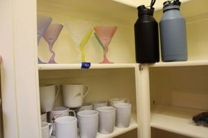 lot 40 image: Crooked stem martini glasses, insulated water bottles and coffee mugs