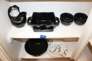 lot 41 image: Black and white dishware with pottery vase with twisted handle