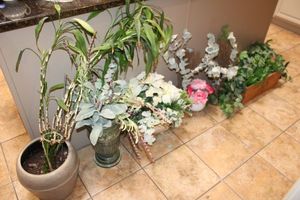 lot 59 image: Artificial flower arrangements and plants