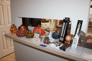 lot 60 image: Fall home dcor with pumpkins and color drip candles