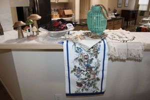 lot 61 image: Table runners, wood mushrooms, glass bowl with Bon Bon silk slippers