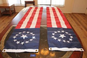 lot 72 image: Pair of Annin Flagmakers Circular stars pull down American flag