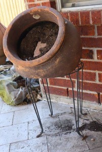 lot 97 image: Angled flower pot with wire stand