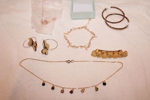 lot 147 image: Jewelry Rose gold bracelet and necklace, wooden butterfly earrings, and more