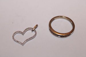 lot 151 image: Jewelry tested as diamond chip heart pendant and silver ring