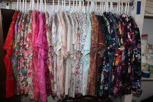 lot 77 image: Large Selection of Two Piece Outfits. These all include Coordinating Pants with Tops size xl Some Homemade