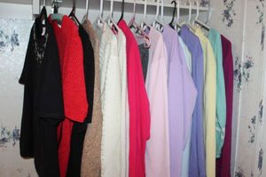 lot 90 image: Several 2 Piece Sweat suits and Short Sleeve Sweaters XL