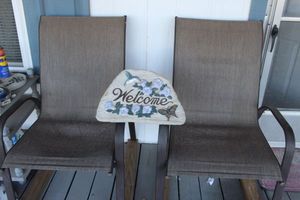 lot 334 image: Two Patio Chairs and Welcome Stone