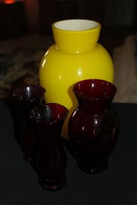 lot 134 image: Vases, One Large Yellow Glass Vase and Three smaller Red Vases