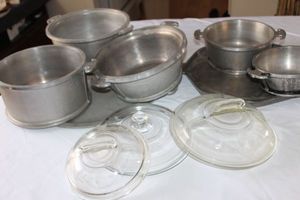 lot 22 image: 1950s 7 Piece Guardian Hammered Aluminum Cookware with Glass Lids