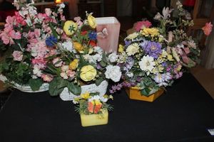 lot 211 image: Three Spring Floral Arrangments, Butterfly Ceramic Vase and Yellow Wax Vase with Buttetfly floral dcor