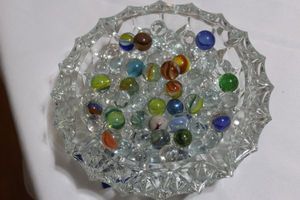 lot 221 image: Glass Dish with Clear Marbles, Cats Eye Marbles and More