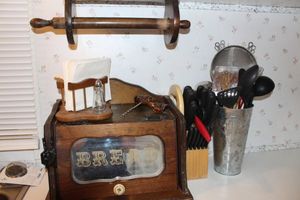 lot 235 image: Wooden Bread Box, Matching Paper Towel Holder, Napkin Holder with Salt and Pepper Shakers, Butcher Block with Knives and Cooking Utensils with Holder
