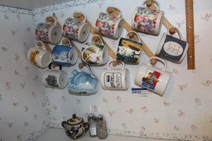 lot 237 image: Coffee Cups, with Hanging Rack Sugar Dish ad Salt and Pepper Shakers