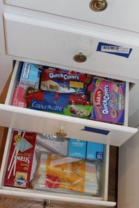 lot 274 image: Contents of Bottom 2 Drawers (Foil, Ziploc bags, Dish Covers, Parchment papers and more