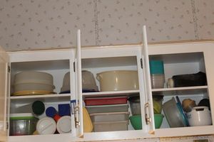 lot 280 image: Three Cabinets of Plastic ware and Tupperware all with Lids