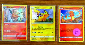 lot 91 image: POKEMON CHARIZARD, PIKACHU, & CHARMANDER HOLO CARDS