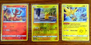 lot 92 image: POKEMOM CHARMELEON, PIKACHU, AND ZAPDOS HOLO CARDS