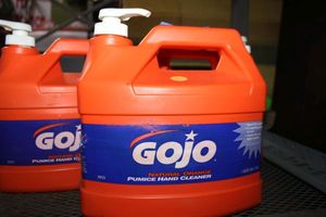 lot 7 image: Three 1-gallon jugs of Gojo natural orange pumice hand cleaners