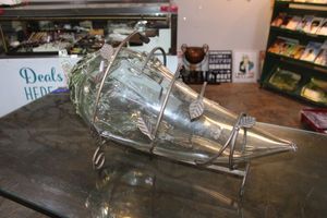 lot 55 image: Large glass chili pepper with metal wire stand