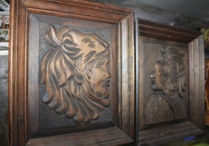 lot 62 image: Two Framed wood carved faces