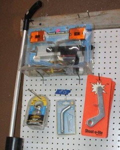 lot 13 image: Trailer lights, Shoot-a-lites, Hitch ball, pin and clip set, and hand held ground markerpainter