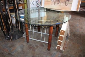 lot 56 image: Thick glass top table with bamboo style legs - 44 round, 27 H