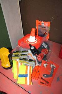 lot 20 image: Safety lot Shoot-a-lites, utility knives, helmet neck shades, headband earplugs, gloves, safety glasses, flashlight and collapsible cone