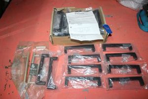 lot 27 image: Cabinet pulls - 30 count black pulls plus 2 Misc.