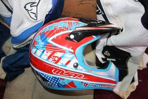 lot 49 image: Motorcrosscycle gear and helmet Thor mx pants and more