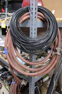 lot 66 image: Plastic black tubing and heavy duty hose