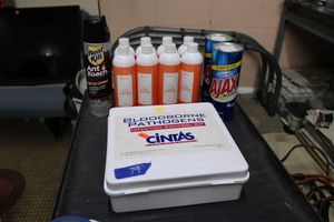 lot 79 image: Bloodborne pathogen kit, hand sanitizers, Ajax cleaner, Roach killer