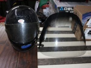 lot 135 image: Bell motorcycle helmet and Honda shield