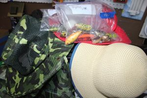 lot 100 image: Fishing lures and hats