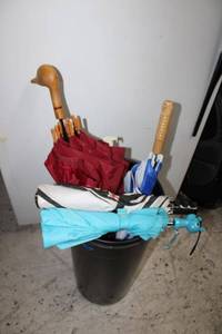 lot 110 image: Umbrellas and umbrella holder