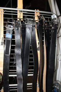 lot 112 image: Black leather belts. Some marked Genuine Leather Government Cert