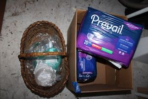 lot 147 image: (2) Prevail Med. Size adult underwear, and basket with medical hoses