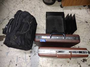 lot 214 image: Briefcases, travel bag, and desktop paper sorter