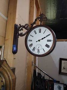 lot 215 image: Two-sided wall clock